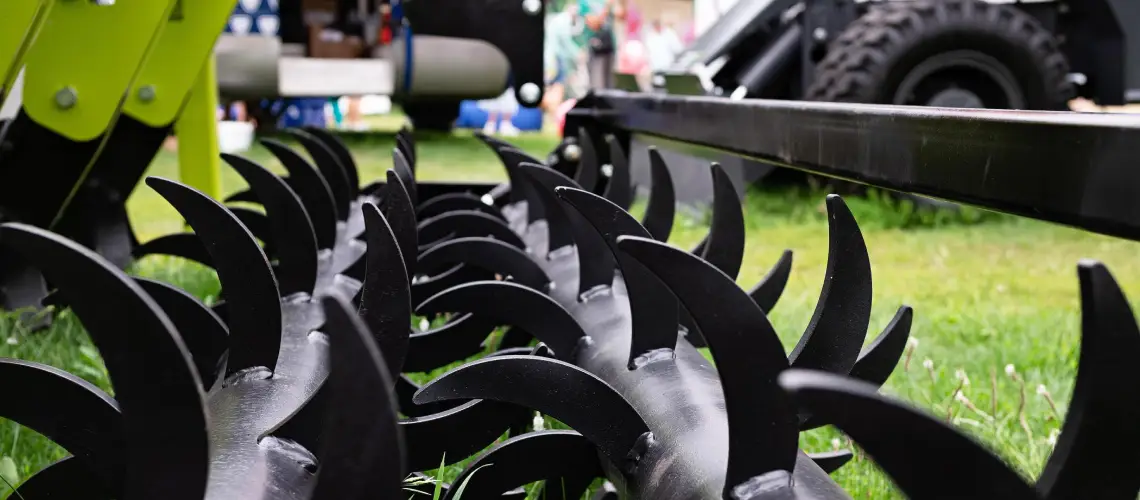 Valuer conducting an agricultural equipment valuation on modern farming machinery